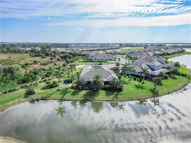 Drone / aerial view with a residential view and a water view