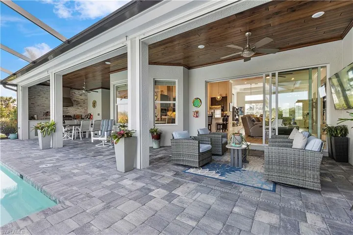 View of patio / terrace featuring ceiling fan, a lanai, and an outdoor hangout area