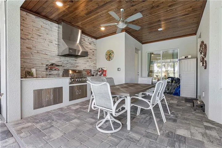 Dining space with recessed lighting, wood ceiling, ceiling fan, and crown molding