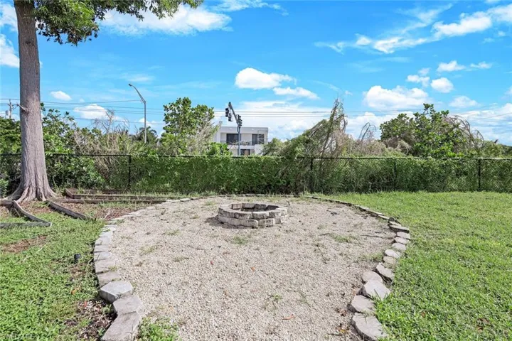 View of yard featuring an outdoor fire pit