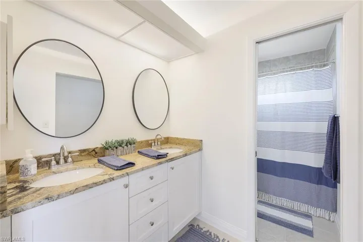 Bathroom featuring dual vanity