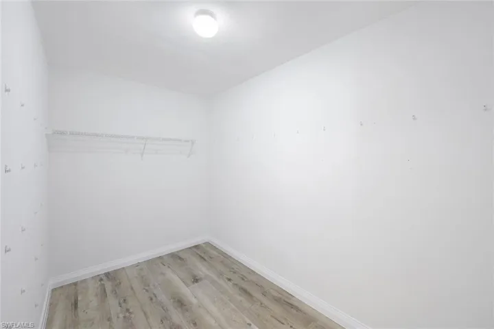 Walk in closet featuring light hardwood / wood-style floors