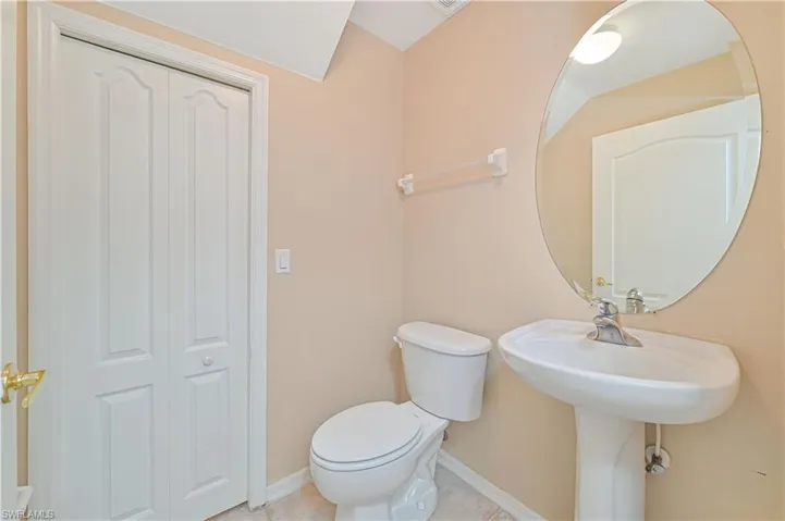 Bathroom with tile flooring and toilet