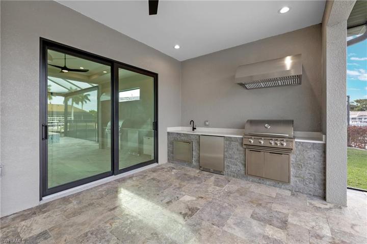 Large lanai with summer kitchen