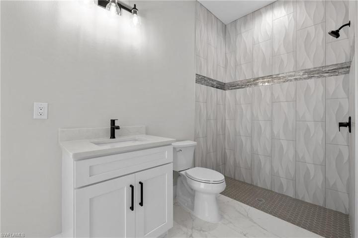 Guest bath 1 attached to guest bedroom 1 (pool. bath)