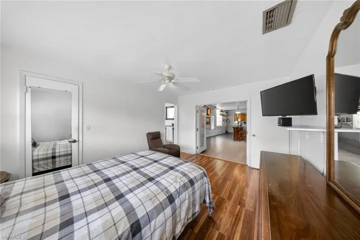 This room features light-colored walls and wood-look flooring