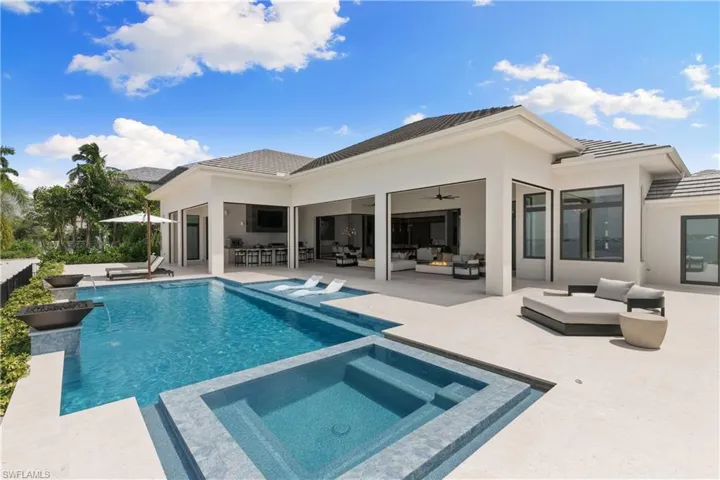 1400 sq. ft of covered outdoor space with sun shelf for relaxing in your heated, saltwater pool, Shell stone pool deck, pool storage, pool bath.