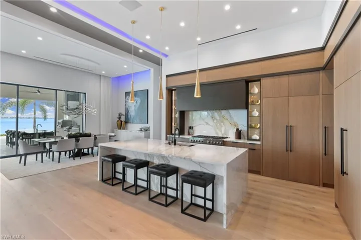 Formal dining area with tranquil views of the river and a marble top floating buffet..