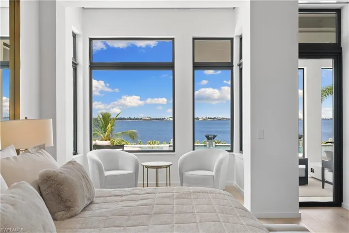 Private and spacious primary suite, a haven of tranquility offering sweeping water views