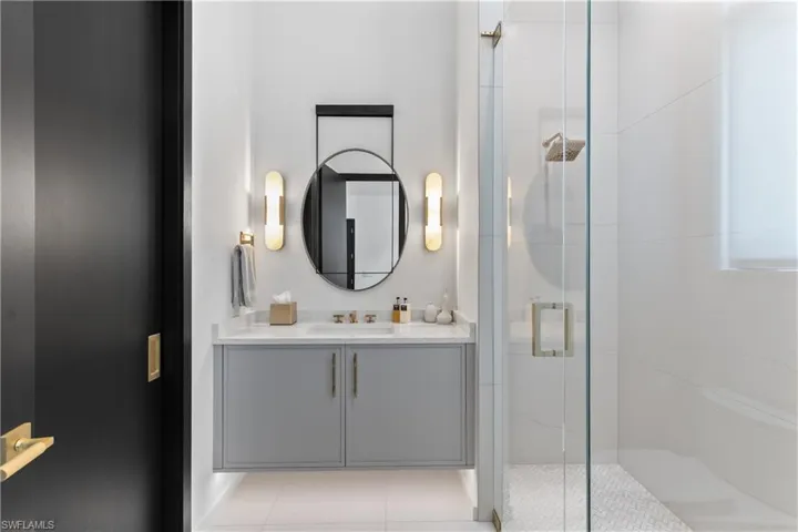 4th full ensuite bath with walk-in seamless glass shower.