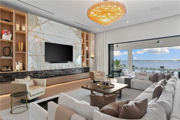 In-ceiling Ketra lighting system powered by Loxone Smart Home Automation for alarm, climate system, lighting, allowing for effortless mood changes to suit any occasion. 14 ft. cloud design ceilings.