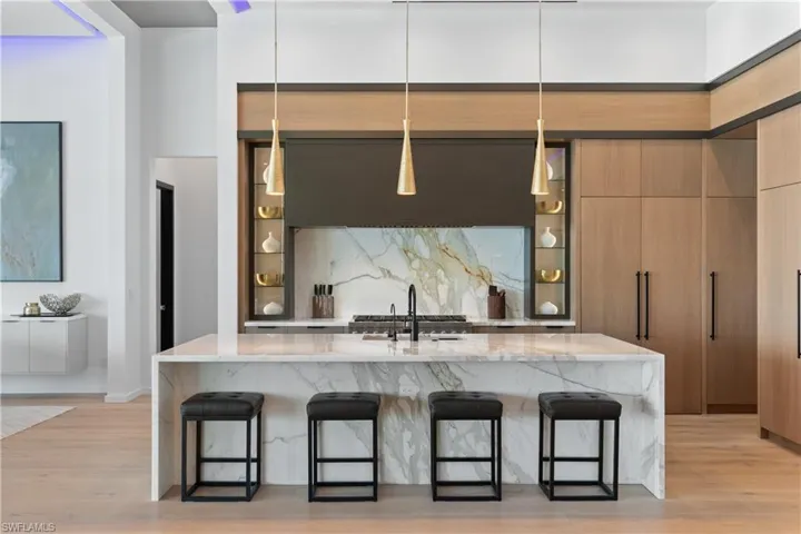 Expansive chef's kitchen, boasting the highest-end appliances from Wolf, Sub-Zero, True, and more