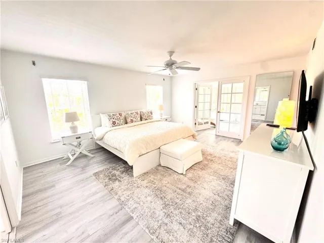 Master Bedroom with light wood finished floors and ceiling fan
