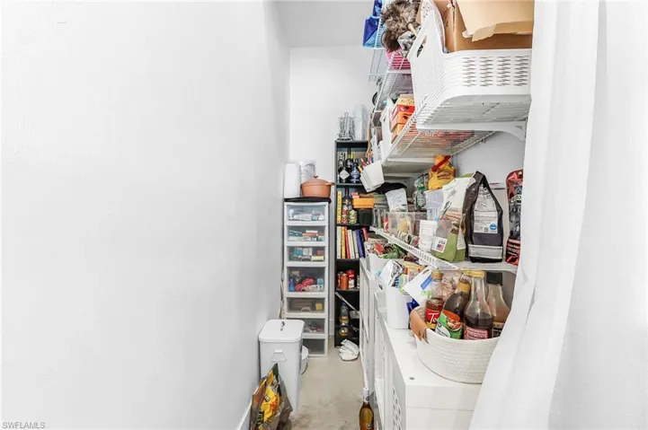 Storage area featuring washer / clothes dryer