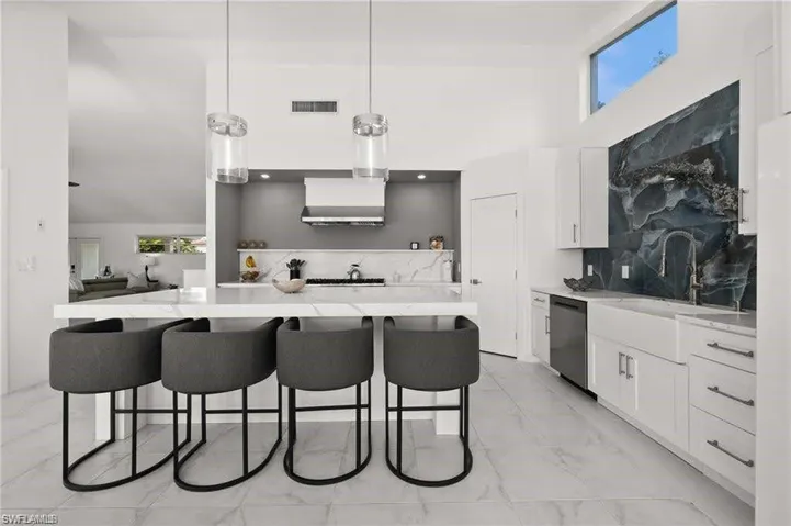 The remodeled kitchen features a large, spacious island