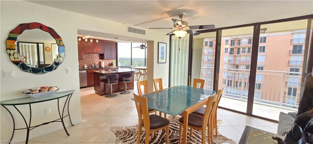 Dining area featuring ceiling fan and light tile patterned floors