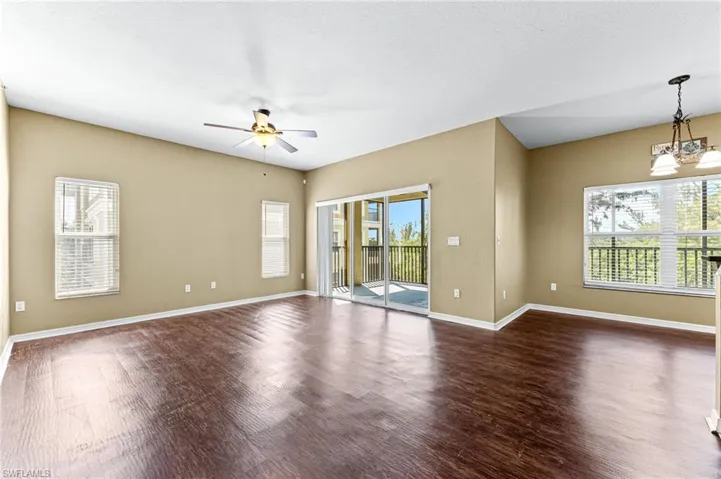 Large family room open to the kitchen and dining area - sliders out to the lanai
