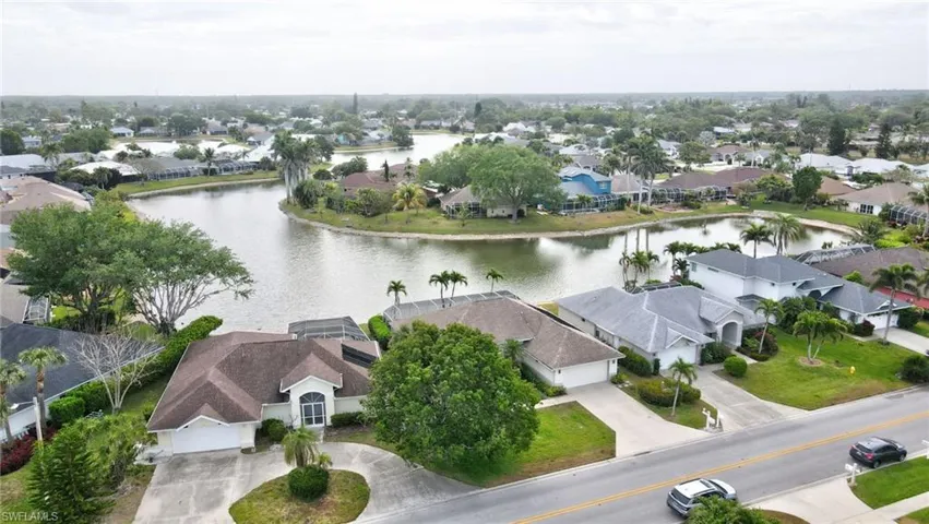 Aerial view with a water view and a residential view