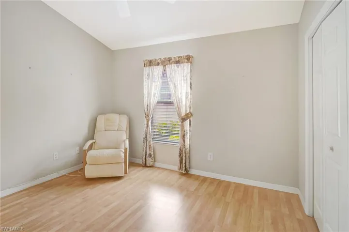 Unfurnished room with baseboards and light wood finished floors