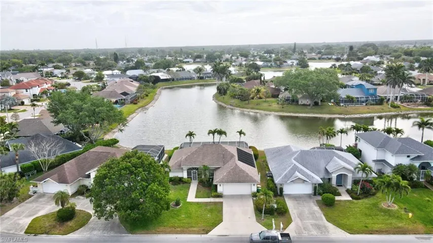 Aerial view with a water view and a residential view