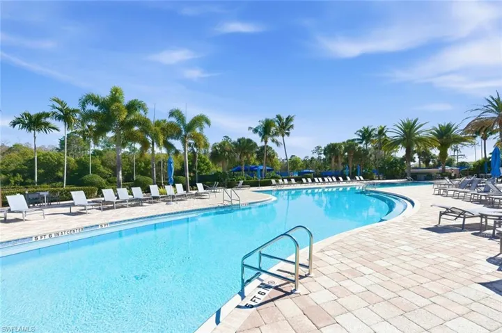 Community pool with a patio
