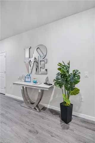 Detailed view of wood finished floors and baseboards