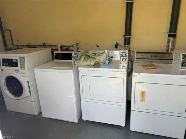 multiple washers and dryers in the laundry room