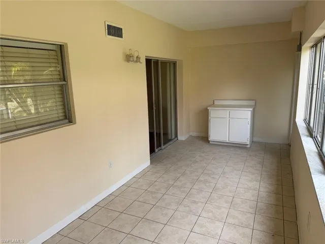 Tiled floors in sunroom with heating and cooling.