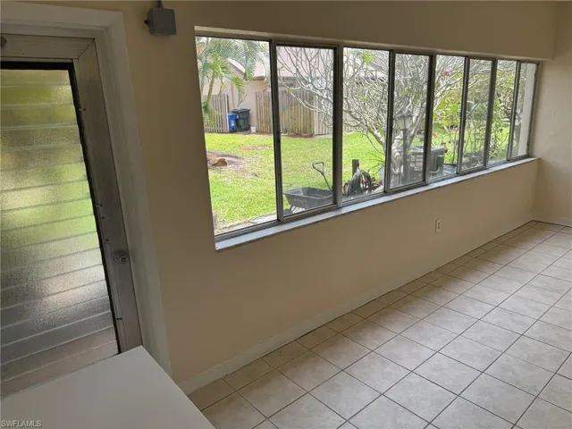 Love the natural light that comes in through all these windows in the sun room.