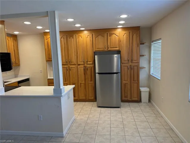 Kitchen has been opened to the living and dining area.
