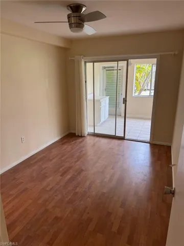 Main bedroom has sliding glass doors that lead to the sunroom that would also make a great office.