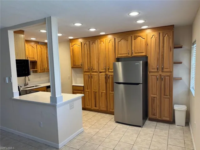 Kitchen is open to the living room and dining area.