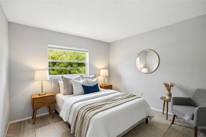Virtually staged photo showing guest bedroom.