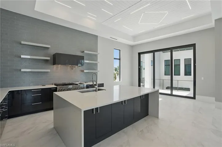 Kitchen featuring dark cabinets, open shelves, light stone counters, modern cabinets, and wooden ceiling Virtually Enhanced