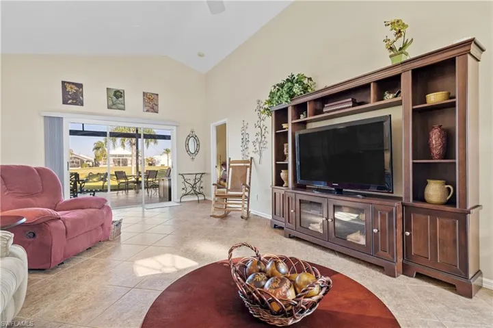Tiled living room with vaulted ceiling