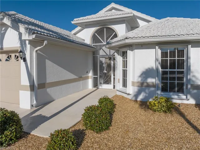 Entrance to property with a garage