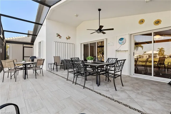 View of patio / terrace with a lanai and ceiling fan