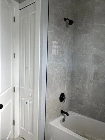 Bathroom featuring tiled shower / bath