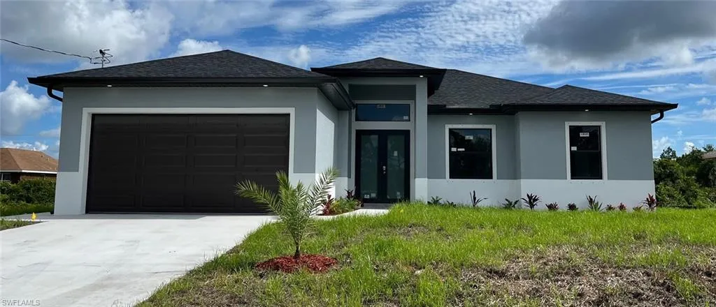 Prairie-style home featuring a garage