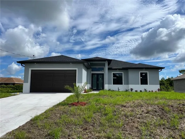 Prairie-style house with a garage