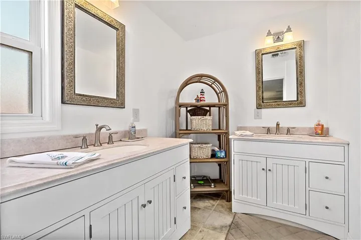 Bathroom featuring tile floors and vanity