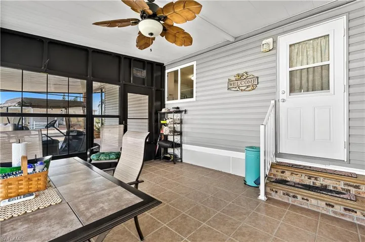 Office area with ceiling fan and tile flooring