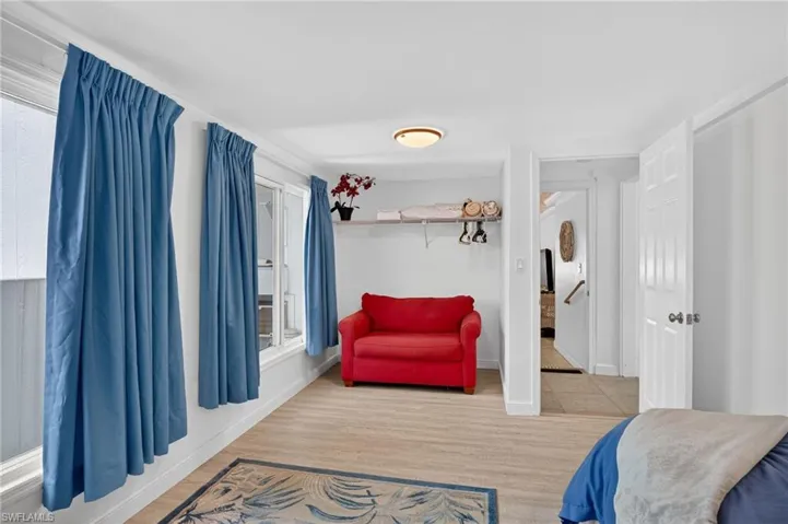 Bedroom 4 featuring light wood finished floors and baseboards