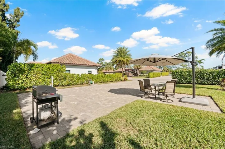 View of patio featuring a grill
