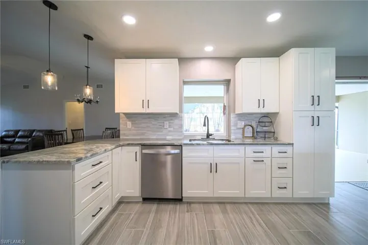 The Kitchen Has New Cabinets, Granite Countertops, Tile Backsplash, Stainless Steel Appliances, And New Pendant Lights!