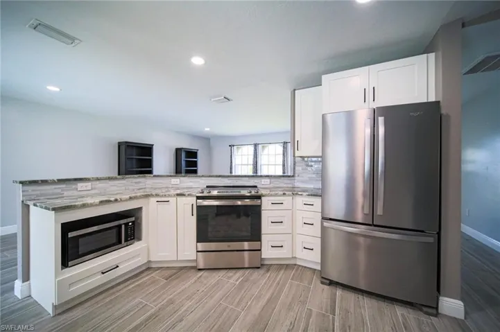 The Kitchen Has New Cabinets, Granite Countertops, Tile Backsplash, Stainless Steel Appliances, And New Pendant Lights!