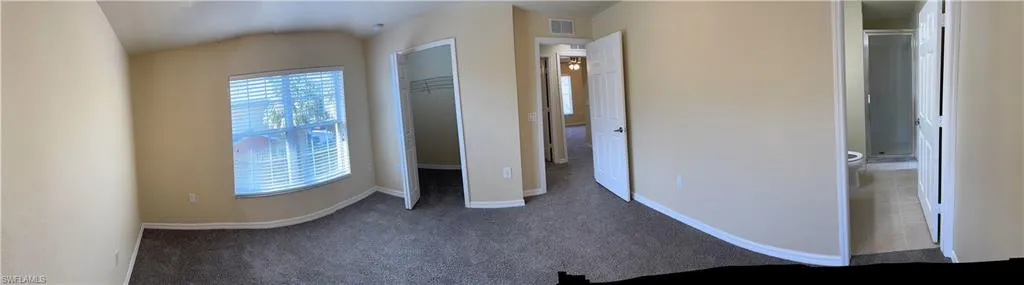 Unfurnished bedroom featuring carpet floors