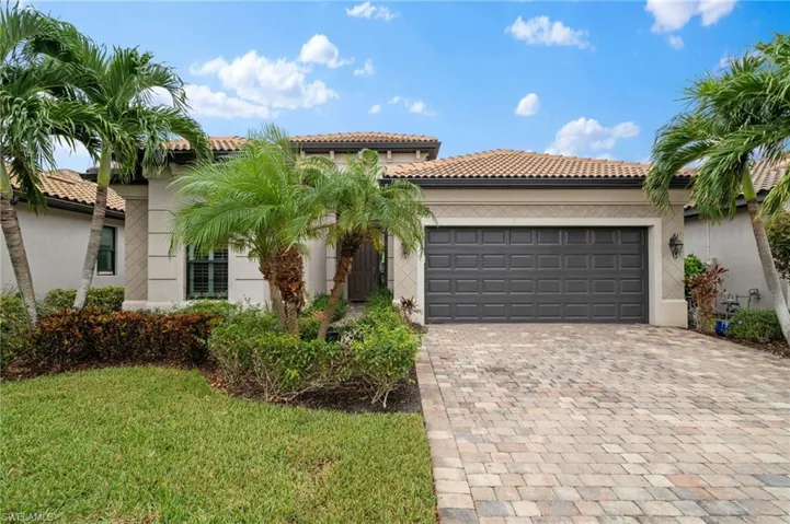 Mediterranean / spanish-style house featuring a garage