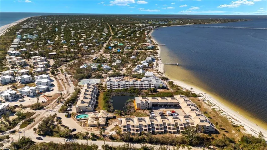 View of property location with a nearby body of water and nearby suburban area