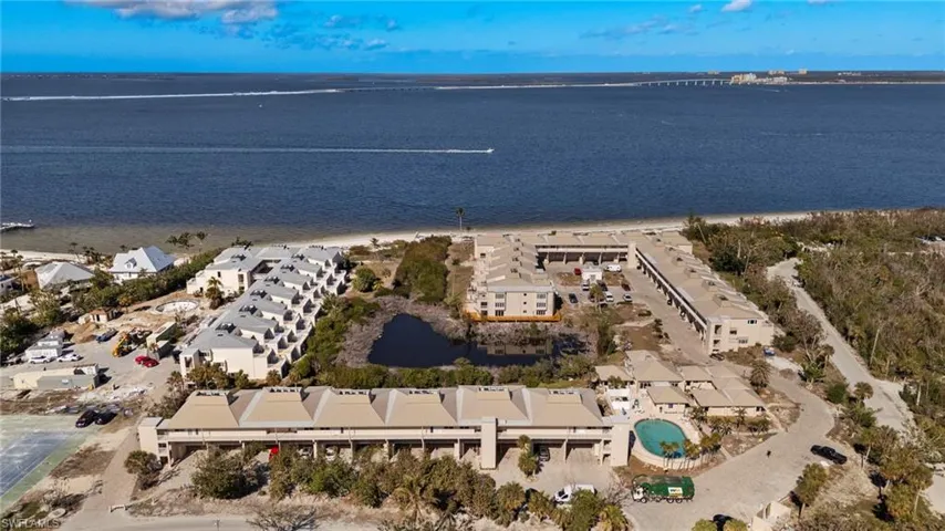 View of property location featuring a large body of water and apartment complex / building